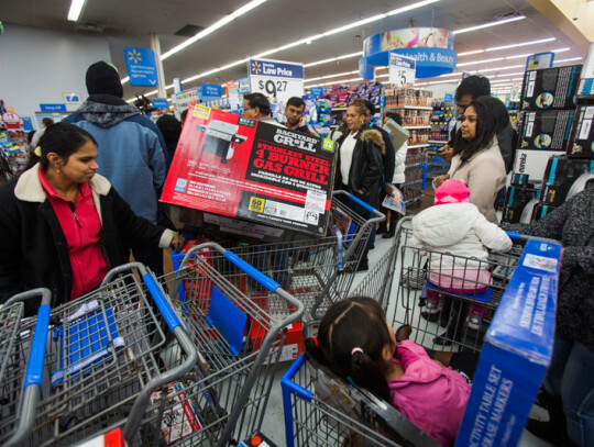 Black Friday Shoppers Line Up on Thanksgiving Day