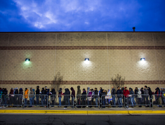 Black Friday Shoppers Line Up on Thanksgiving Day