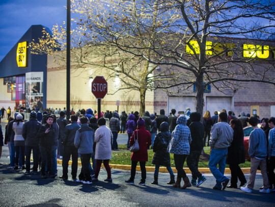 Black Friday Shoppers Line Up on Thanksgiving Day