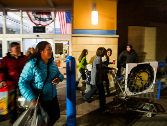 Black Friday Shoppers Line Up on Thanksgiving Day