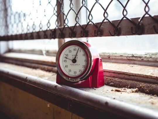 red-and-white-metal-gauge-with-arrows-pointing-to-48-and-4-2092512