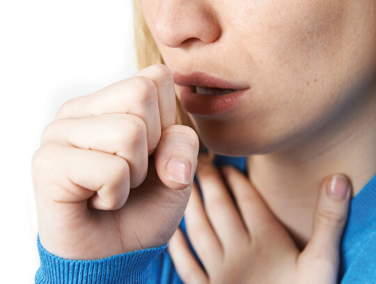 Close Up Of Woman Suffering With Cough