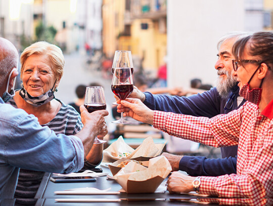 Group of old people eating and drinking outdoor - Doubble date w