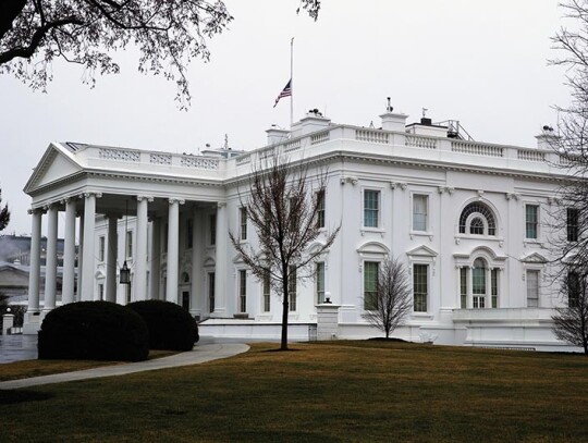 US national flag flies at half-staff over the White House, Washington, USA - 18 Mar 2021