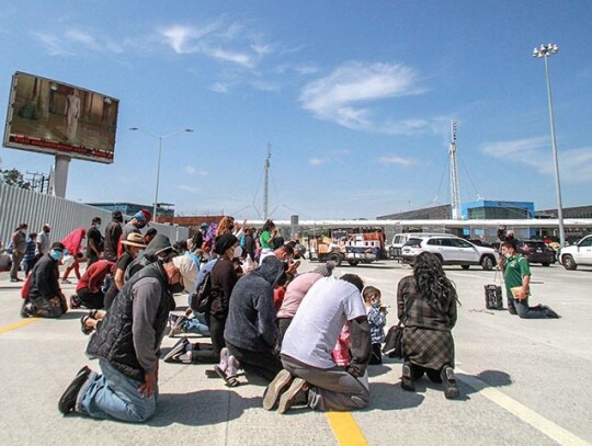 Migrants pray for the opening of the Mexico-US border in Tijuana - 24 Mar 2021