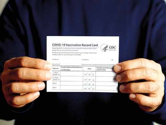 Vaccination record card. Vaccination form during the coronavirus