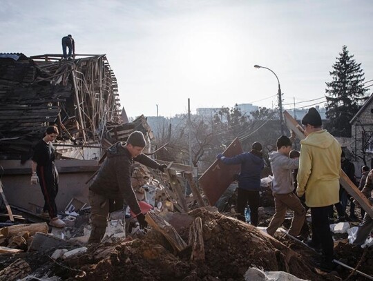 Volunteers clear debris at the site of a Russian New Year's Eve missile attack in Kyiv, Ukraine - 03 Jan 2023