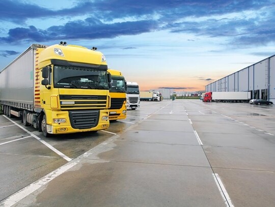 Cargo truck at warehouse building