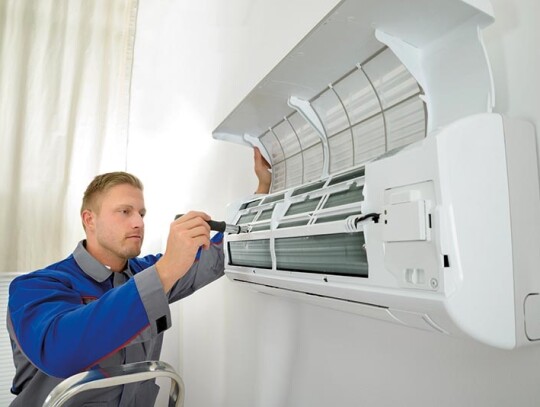 Repairer Repairing Air Conditioner