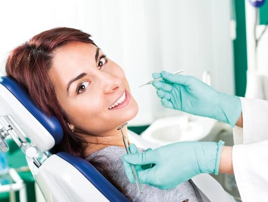 Smiling woman at dentist