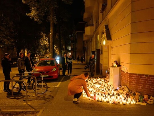 People place candles in memory of a five-year-old boy stabbed in Poznan, Poland - 18 Oct 2023