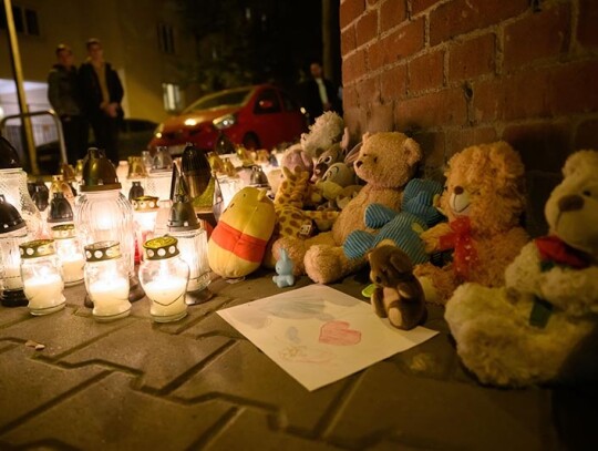 People place candles in memory of a five-year-old boy stabbed in Poznan, Poland - 18 Oct 2023