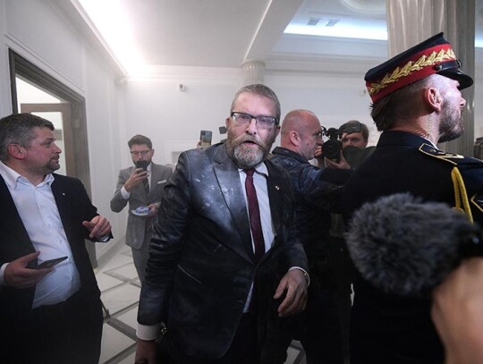 MP Grzegorz Braun extinguishes Hanukkah candles at parliament building in Warsaw, Poland - 12 Dec 2023