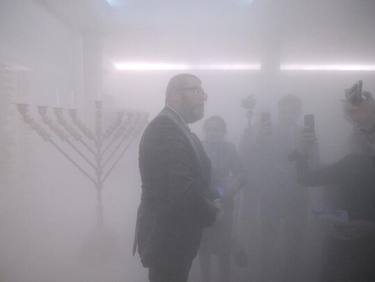 MP Grzegorz Braun extinguishes Hanukkah candles at parliament building in Warsaw, Poland - 12 Dec 2023