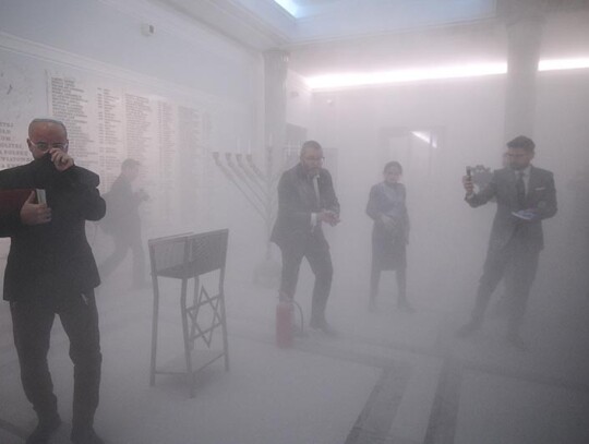 MP Grzegorz Braun extinguishes Hanukkah candles at parliament building in Warsaw, Poland - 12 Dec 2023