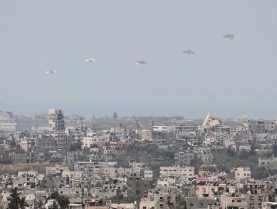 Military planes airdrop humanitarian aid into northern Gaza Strip, Israel Gaza Border - 27 Mar 2024