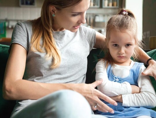 Angry offended little girl ignoring mother words, advice