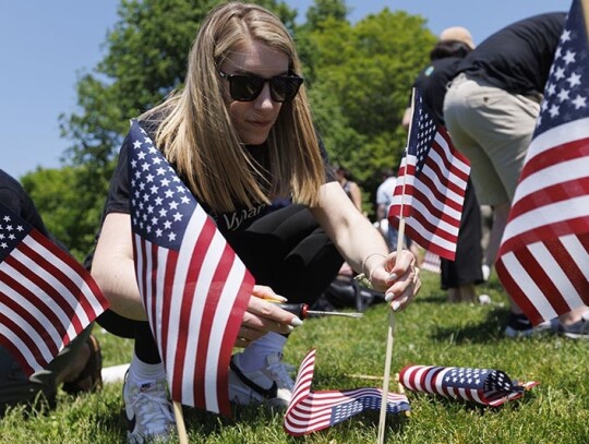 Volunteers plant flags for Memorial Day Flag Garden on Boston Common, USA - 22 May 2024