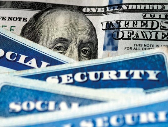 Social Security Cards with US One Hundred Dollar Bill $100