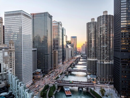 Chicago skylines along river walk at sunset, aerial view of mode